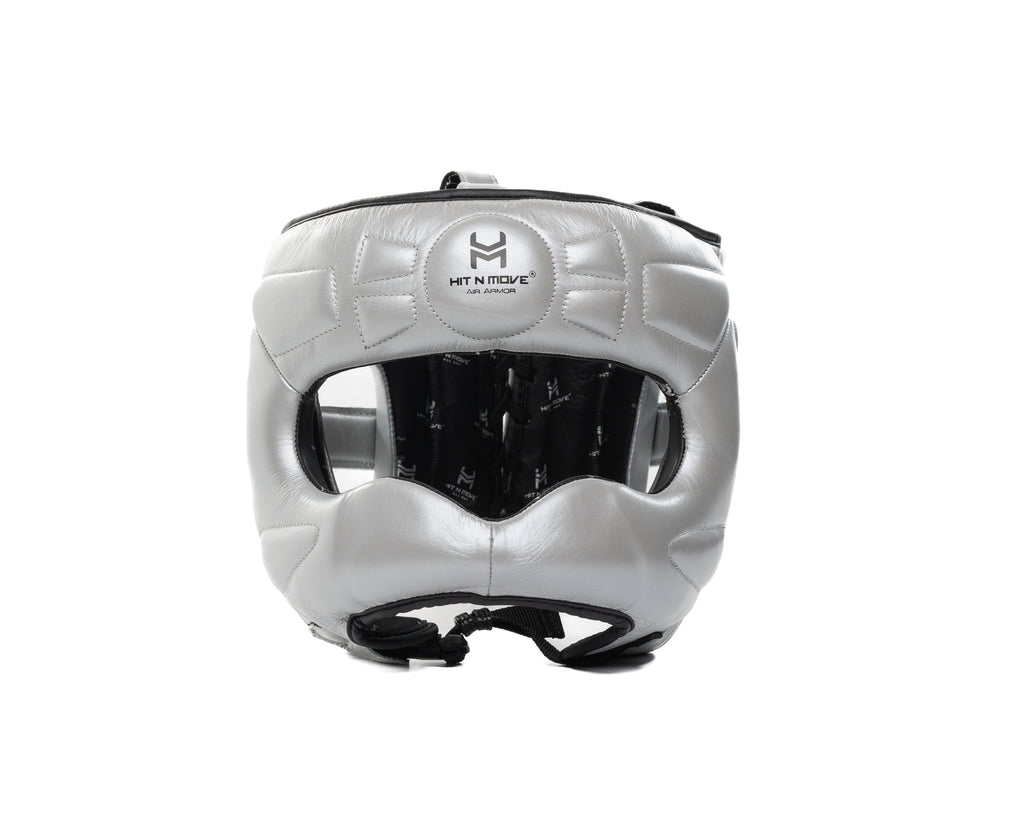 Silver HIT'N'MOVE Face Saver boxing headgear with black logo, padded nose bar and black chin strap, front view