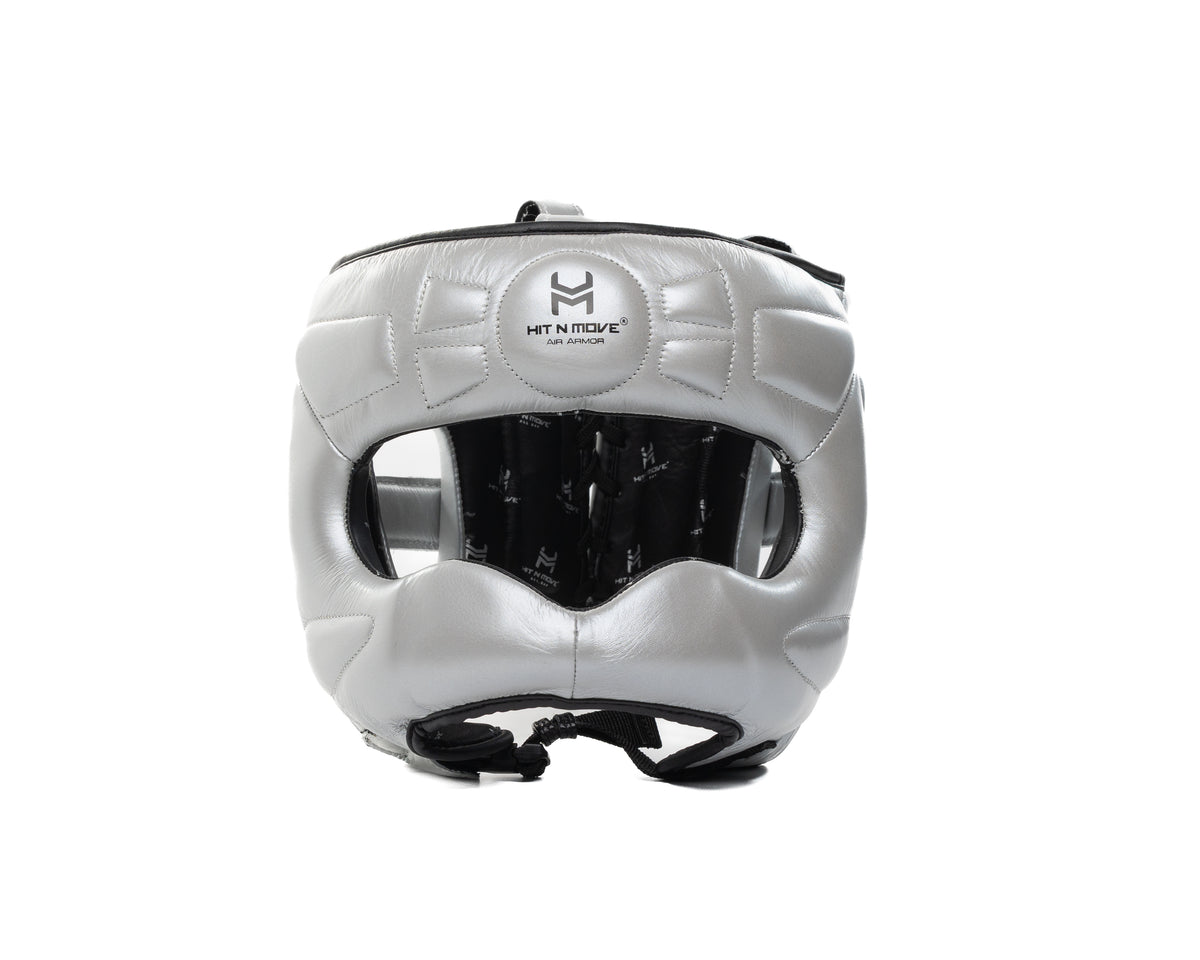 Silver HIT'N'MOVE Face Saver boxing headgear with black logo, padded nose bar and black chin strap, front view